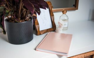 Daily Beauty Routine Planner with a calm vanity, checklist notebook, and neatly arranged beauty products