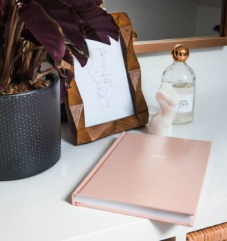 Daily Beauty Routine Planner with a calm vanity, checklist notebook, and neatly arranged beauty products