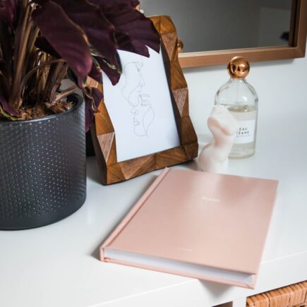 Daily Beauty Routine Planner with a calm vanity, checklist notebook, and neatly arranged beauty products